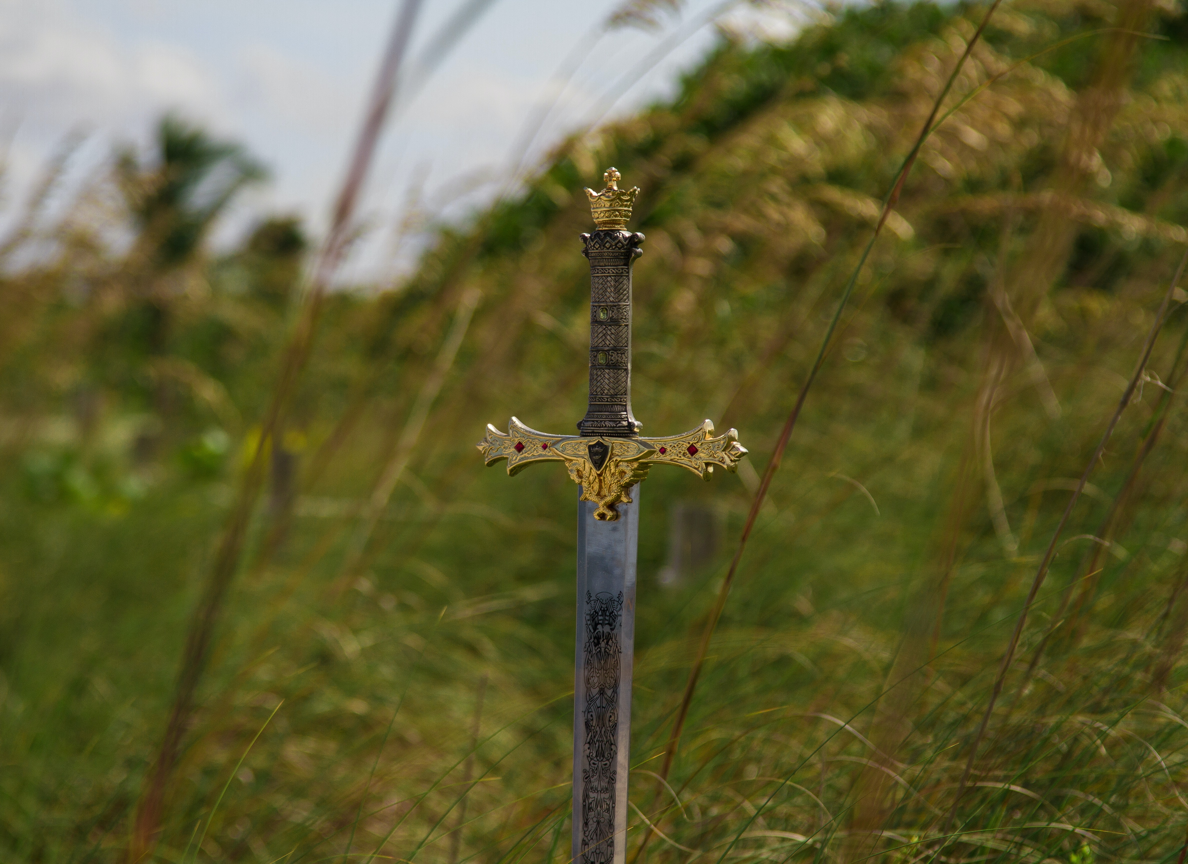 a sword standing in grassy area